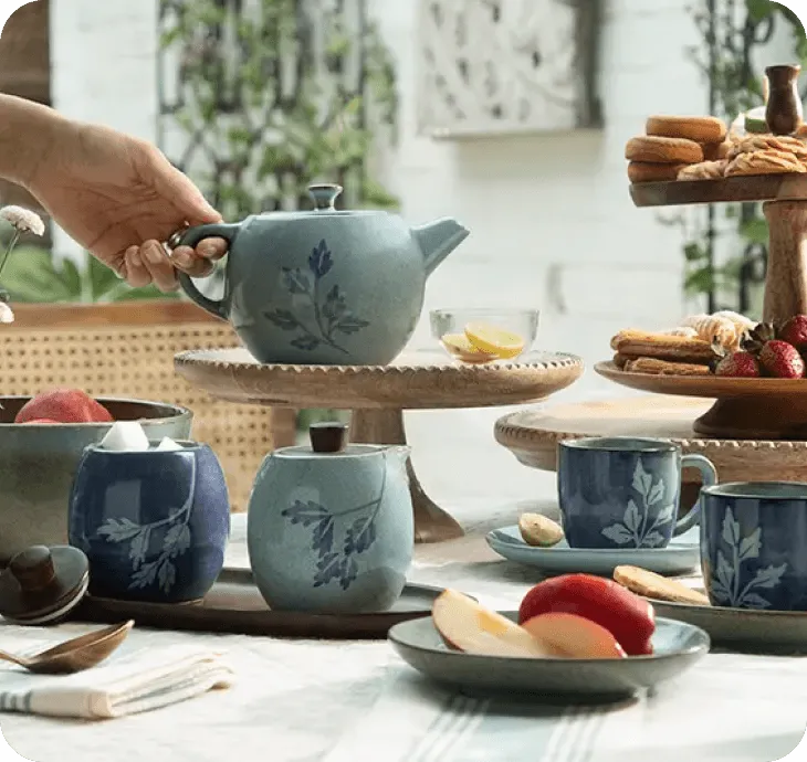 A warm Macha tea set — cups, teapot and snacks